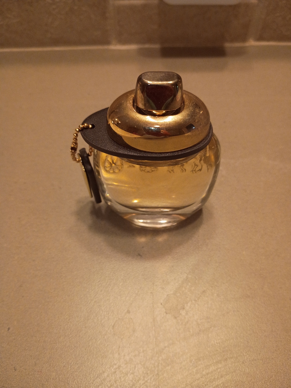 Coach women's Perfume bottle in golden amber